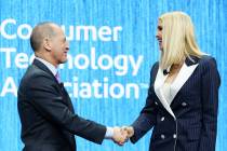 Gary Shapiro, president and CEO of the Consumer Technology Association, shakes Ivanka Trump's h ...