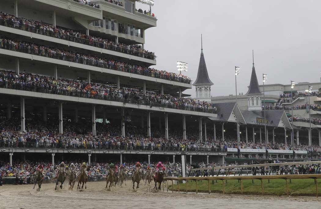 Luis Saez rides Maximum Security, right, during the 145th running of the Kentucky Derby horse r ...