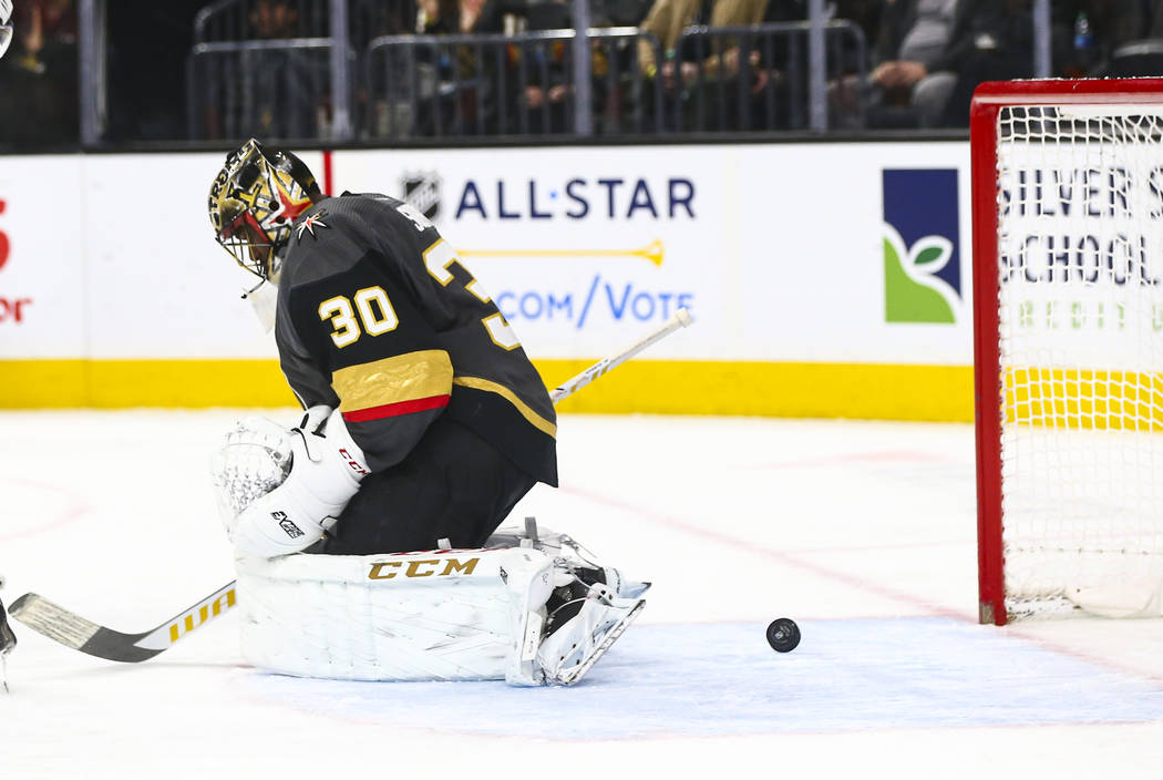 The puck spins around behind Golden Knights goaltender Malcolm Subban (30) during the second pe ...