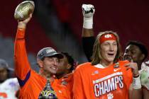 Clemson head coach Dabo Swinney and Trevor Lawrence (16) during the first half of the Fiesta Bo ...