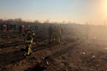 Debris is seen from a plane crash on the outskirts of Tehran, Iran, Wednesday, Jan. 8, 2020. A ...
