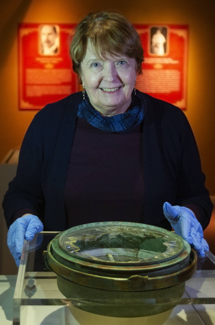 Alexandra Klingelhofer, executive director for collections, with a ship compass recovered from ...