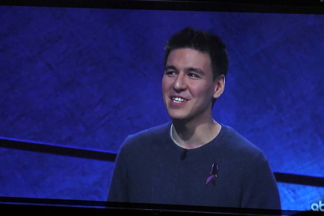 James Holzhauer appears on a TV sceen during a watch party for the “Jeopardy! The&# ...