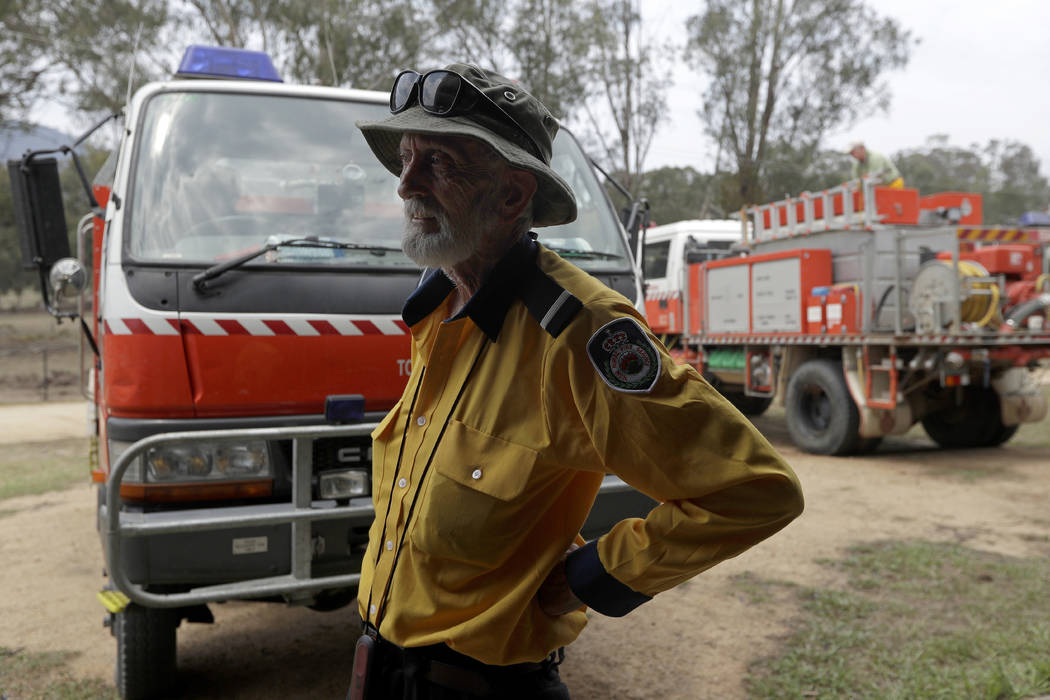 Volunteer firefighter John Nightingale talks about their planned defense against the fire near ...