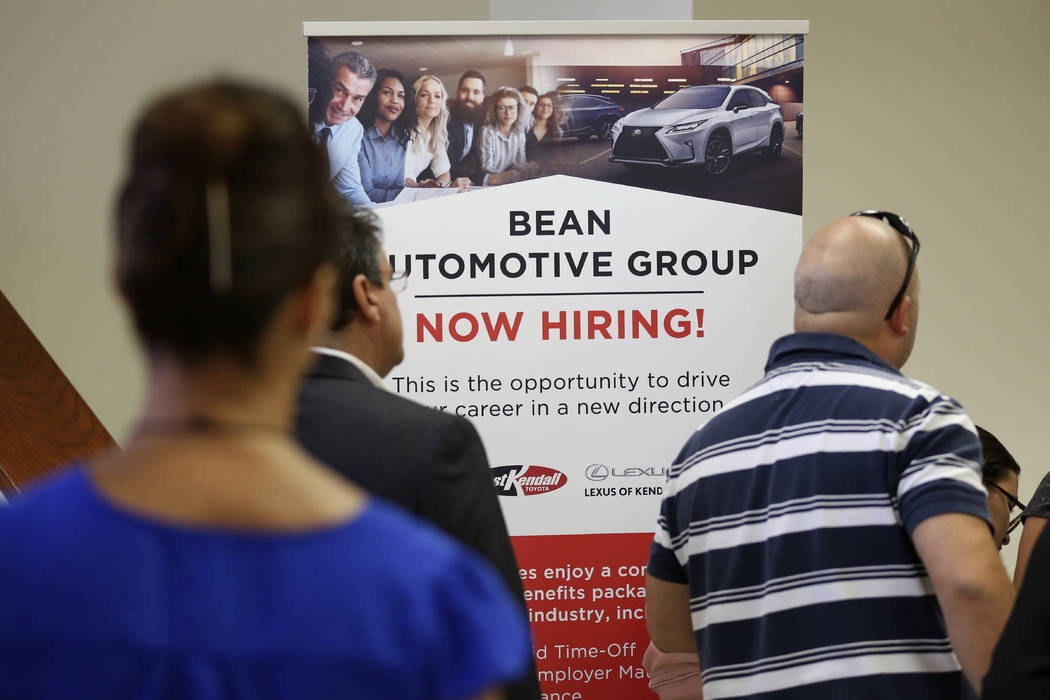 In a Sept. 18, 2019, file photo people stand in line to inquire about jobs available at the Bea ...