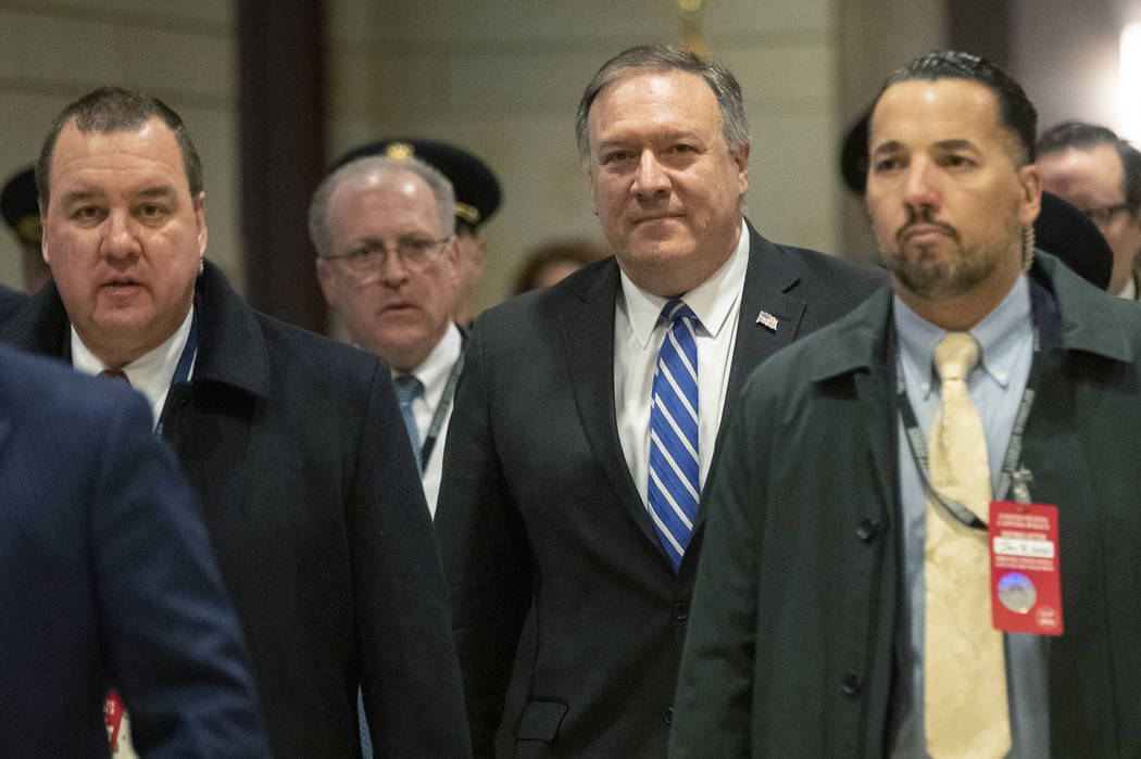 Secretary of State Mike Pompeo, walks towards the Senate after briefing members of Congress on ...