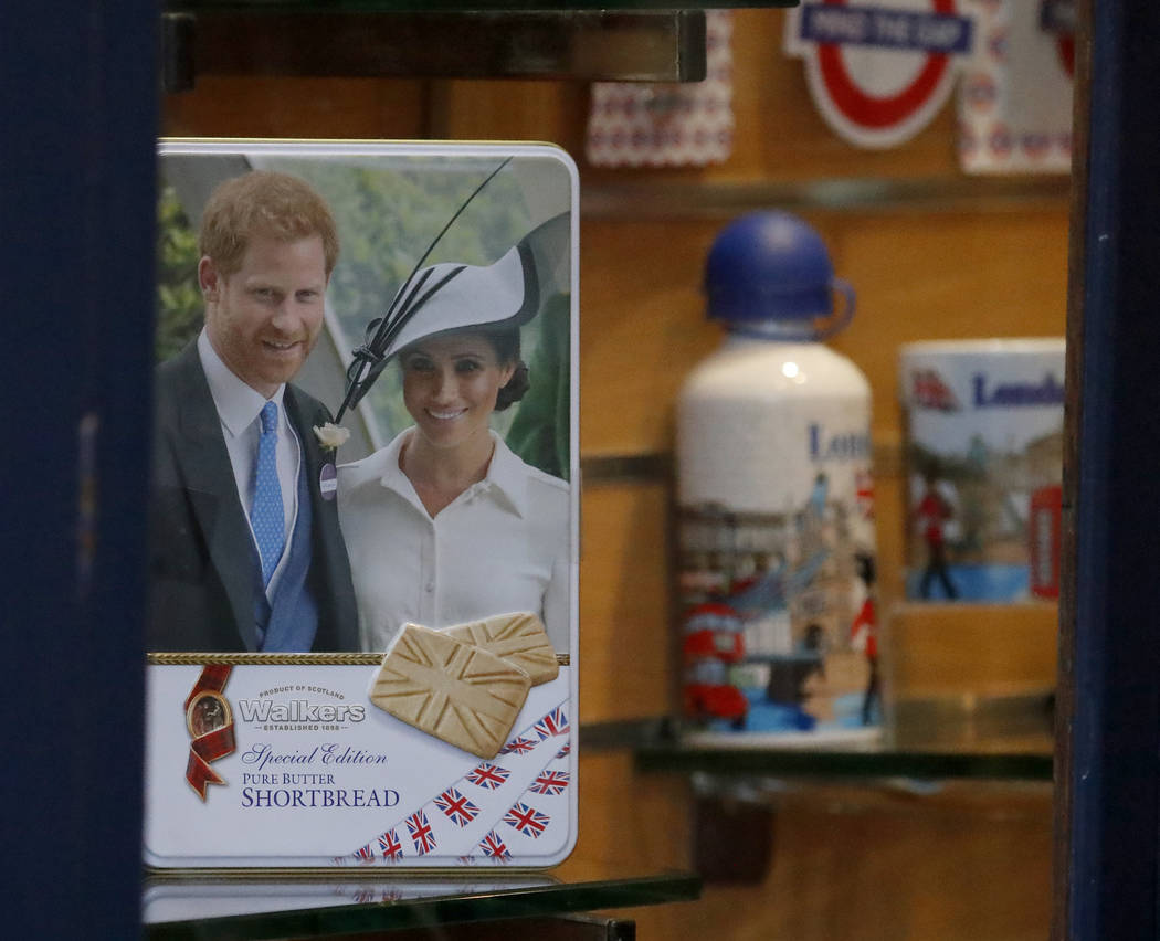 Merchandising products are seen in a shop window in Windsor, England, Thursday, Jan. 9, 2020. ...