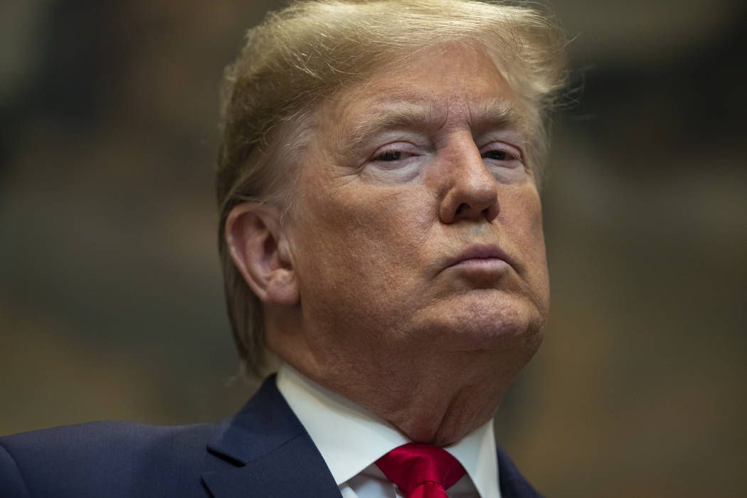 President Donald Trump listens as Secretary of the Interior David Bernhardt speaks on proposed ...