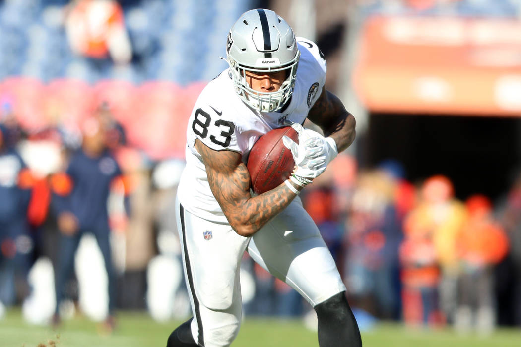 Oakland Raiders tight end Darren Waller (83) catches a ball before an NFL game against the Denv ...