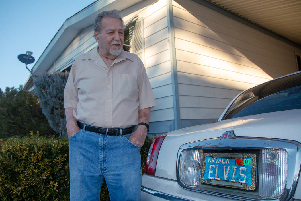 James Mesinger, and 82-year-old, stands next to his Lincoln Town Car with its vanity "Elvis" li ...