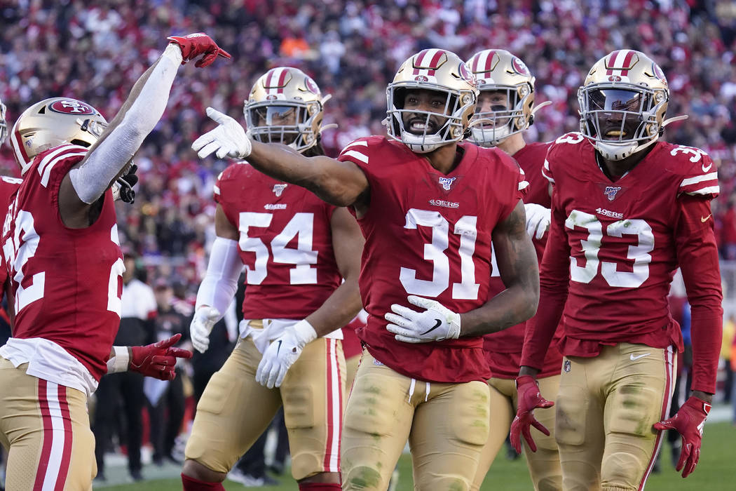 San Francisco 49ers' Raheem Mostert (31) celebrates with teammates after recovering a fumble ag ...