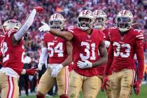 San Francisco 49ers' Raheem Mostert (31) celebrates with teammates after recovering a fumble ag ...