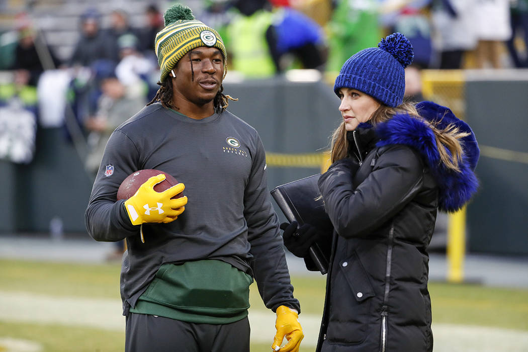 Fox TV reporter Erin Andrews talks to Green Bay Packers' Jamaal Williams before an NFL division ...