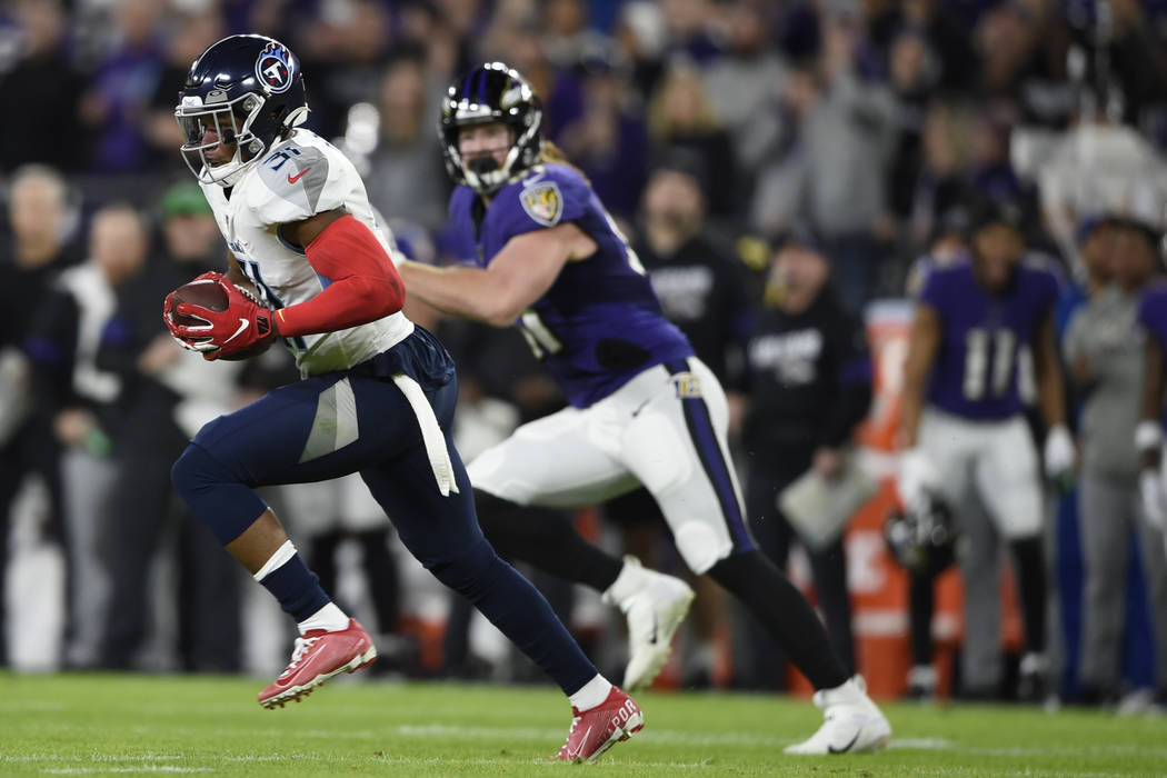 Tennessee Titans free safety Kevin Byard (31) runs an intercepted ball against the Baltimore Ra ...