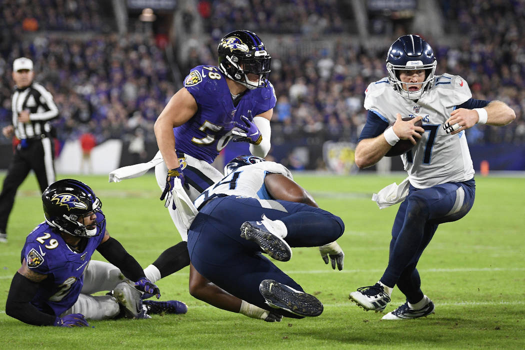 Tennessee Titans quarterback Ryan Tannehill (17) runs to the end zone for a touchdown against t ...