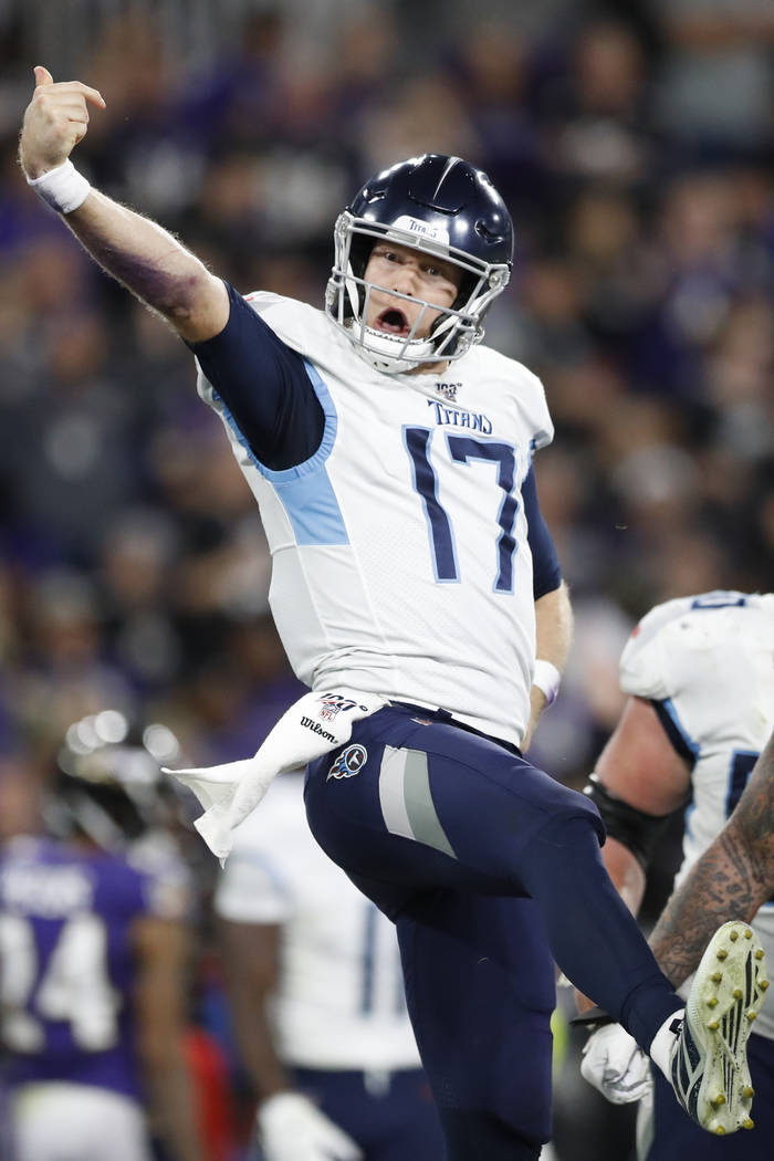 Tennessee Titans quarterback Ryan Tannehill (17) celebrates his touchdown against the Baltimore ...