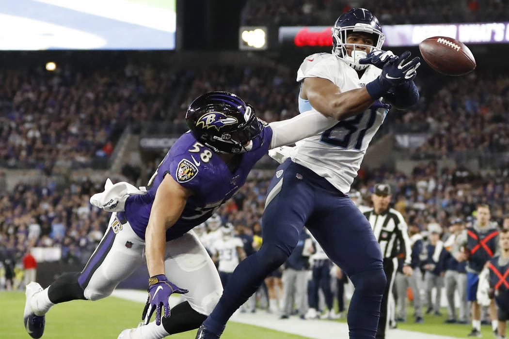 Baltimore Ravens linebacker L.J. Fort (58) breaks up a pass to Tennessee Titans tight end Jonnu ...