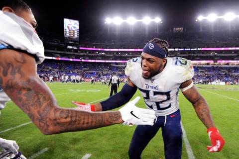 Tennessee Titans running back Derrick Henry (22) celebrates during the second half of an NFL di ...