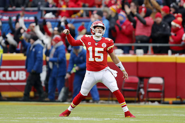 Kansas City Chiefs quarterback Patrick Mahomes (15) reacts after a touchdown by tight end Travi ...