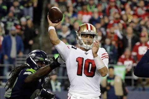 San Francisco 49ers quarterback Jimmy Garoppolo in action against the Seattle Seahawks during t ...