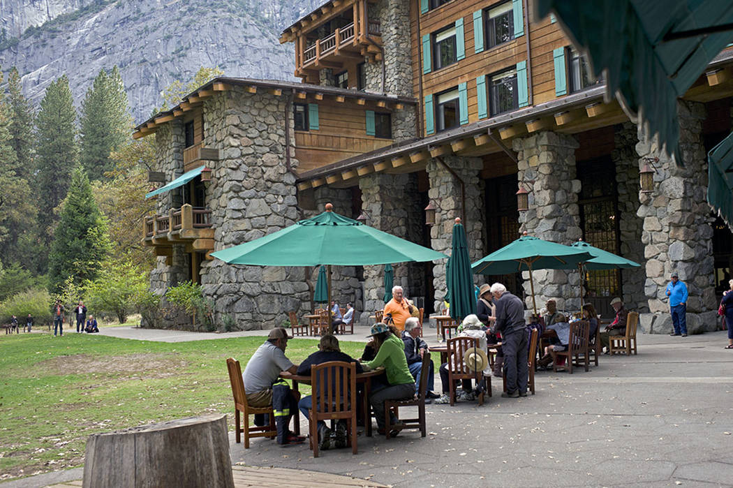 People dine outside the Ahwahnee hotel in Yosemite National Park, Calif., in October 2015. (AP ...