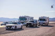 Police work the scene of a fatal officer-involved shooting south of Primm on northbound Interst ...