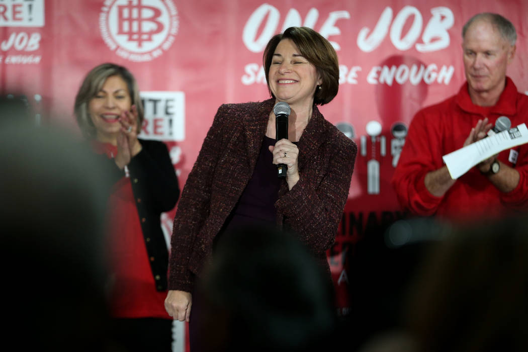 Democratic presidential candidate Amy Klobuchar, center, with Geoconda Arguello-Kline, left, se ...