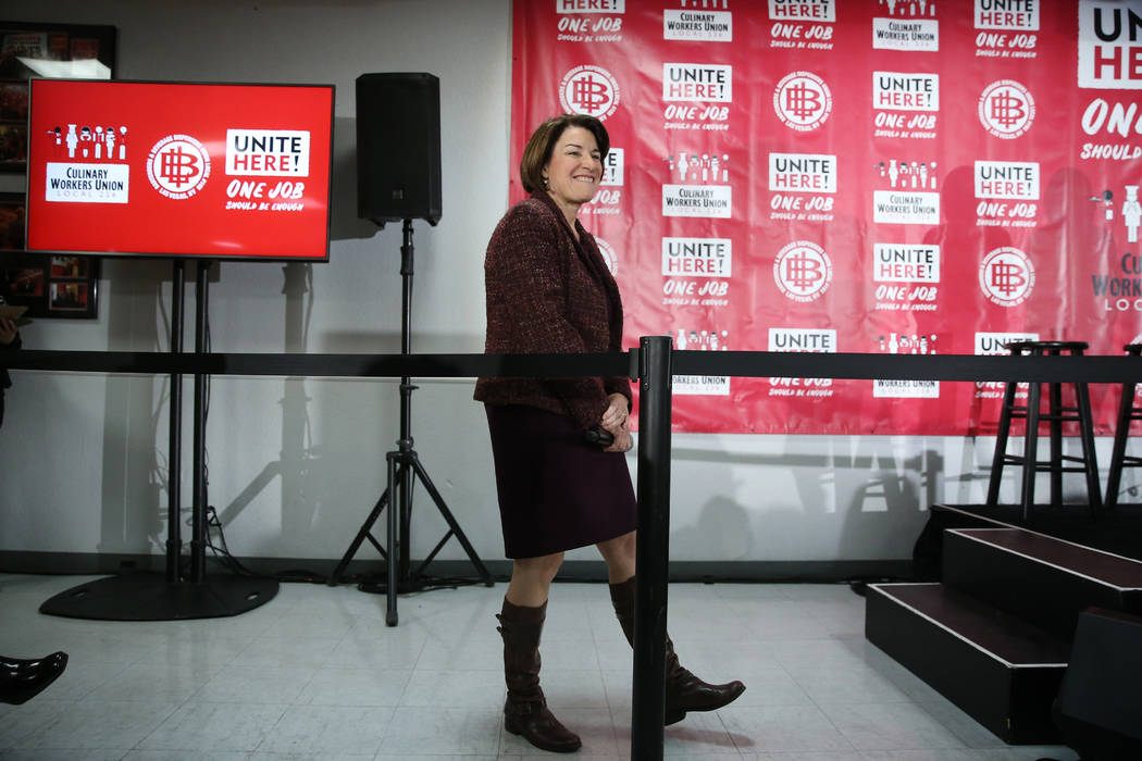 Democratic presidential candidate Amy Klobuchar gets ready to take the stage during a town hall ...