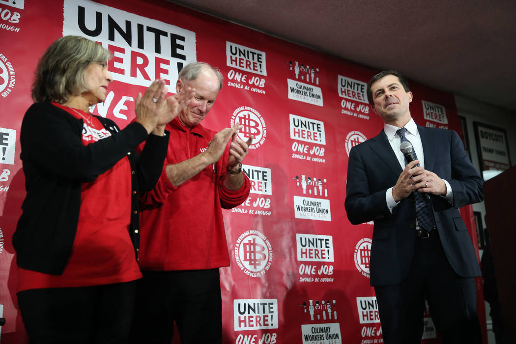 Democratic presidential candidate Pete Buttigieg, far right, is welcomed to the stage by Geocon ...