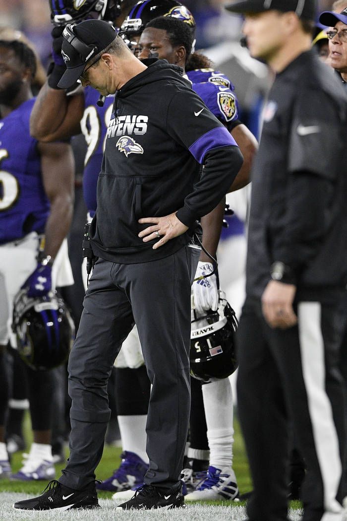 Baltimore Ravens head coach John Harbaugh reacts after a Ravens fumble recovered by the Tenness ...