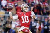 San Francisco 49ers quarterback Jimmy Garoppolo (10) passes against the Minnesota Vikings durin ...