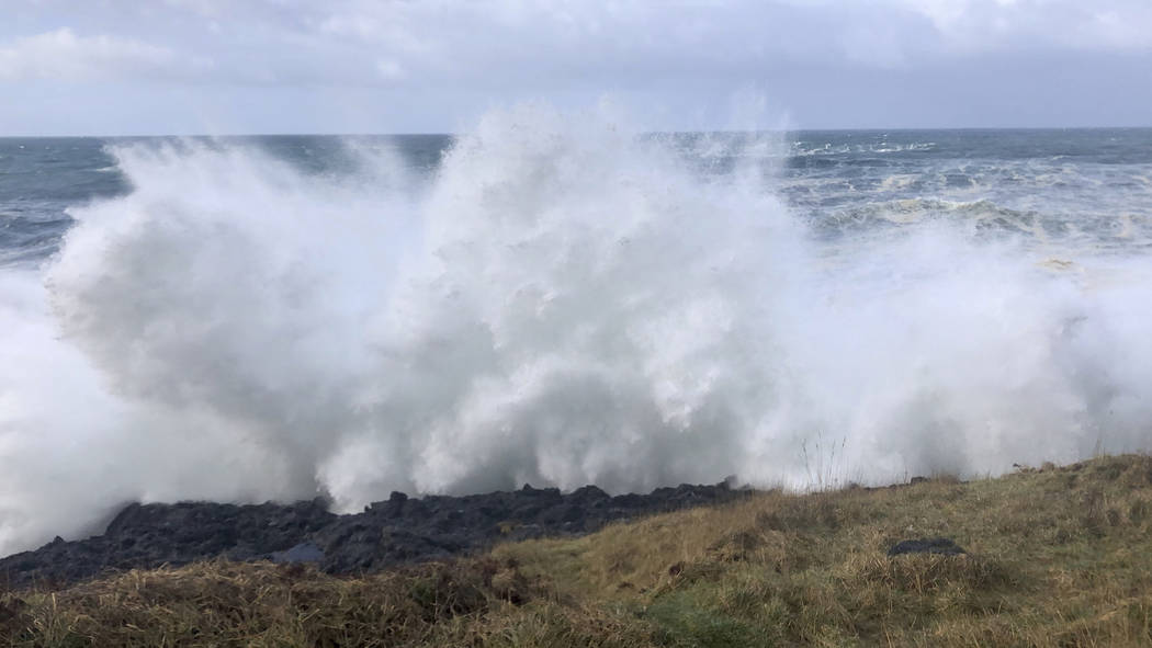 In this Saturday, Jan. 11, 2020, photo strong waves crash on the seashore near Otter Rock in Li ...