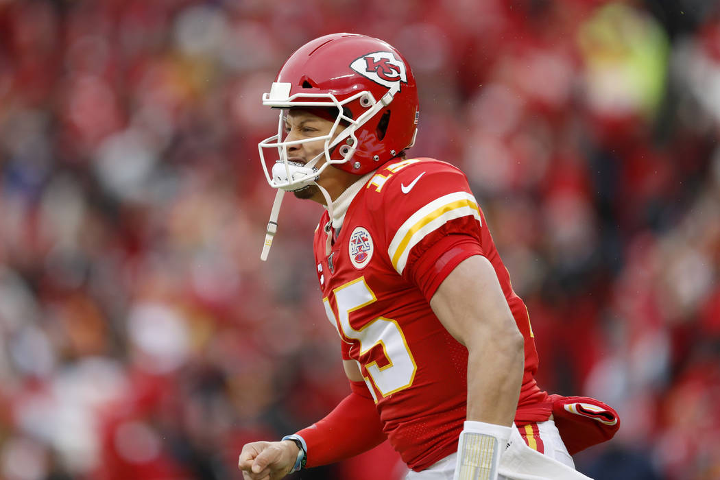 Kansas City Chiefs quarterback Patrick Mahomes (15) reacts after a Chiefs' touchdown during the ...