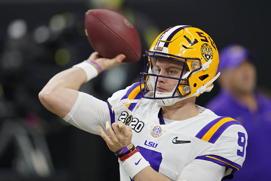 LSU quarterback Joe Burrow warms up before a NCAA College Football Playoff national championshi ...