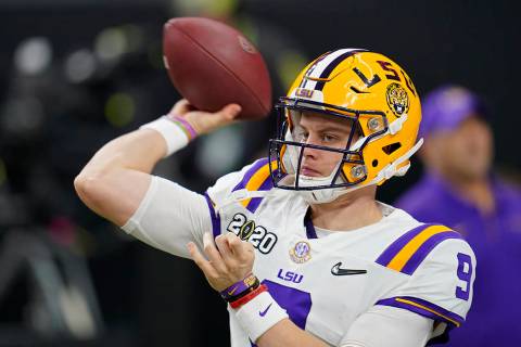 LSU quarterback Joe Burrow warms up before a NCAA College Football Playoff national championshi ...