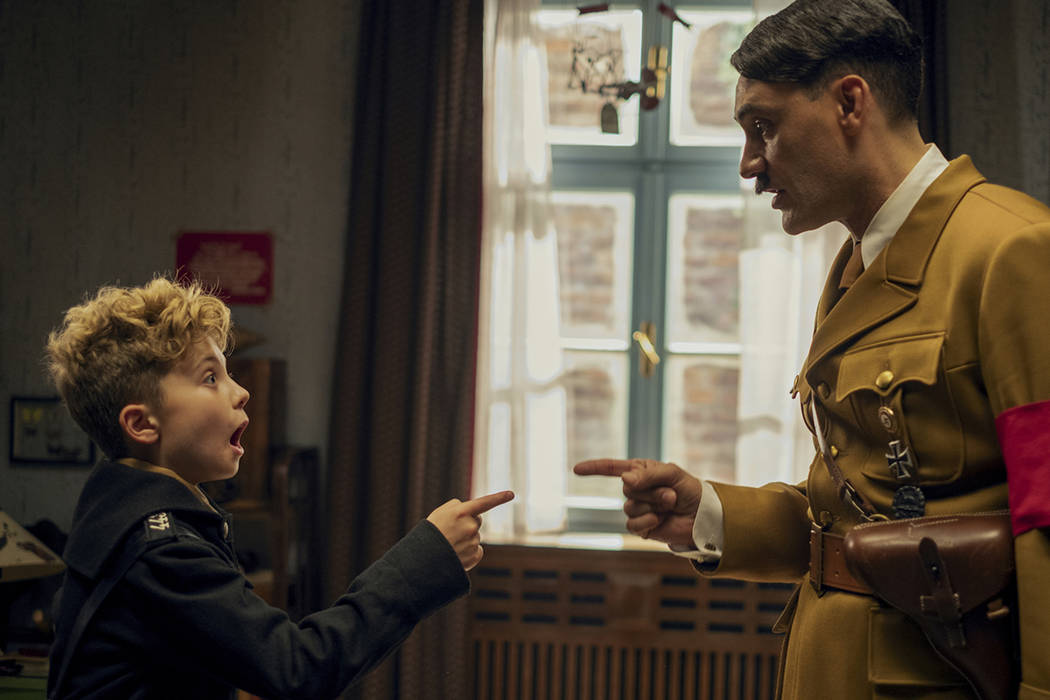 This image released by Fox Searchlight Pictures shows, from left, Roman Griffin Davis and Taika ...