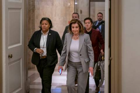 Speaker of the House Nancy Pelosi, D-Calif., arrives at the Capitol in Washington, Friday, Jan. ...