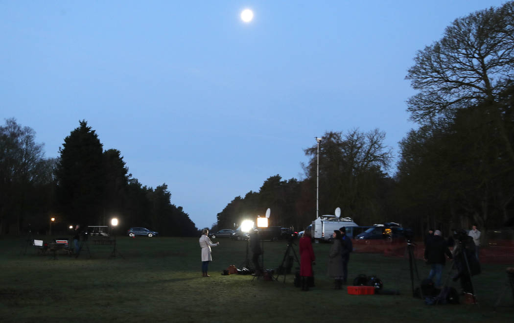 The media prepare at the entrance of Sandringham estate, Sandringham, England, early morning Mo ...