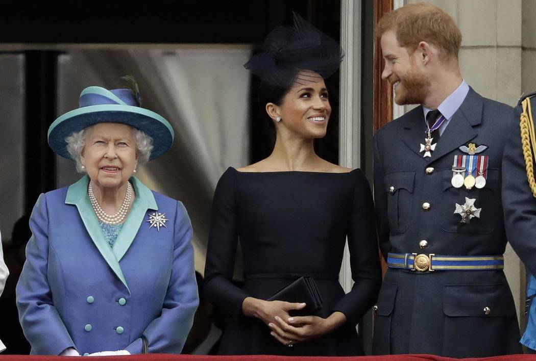 FILE - In this Tuesday, July 10, 2018 file photo Britain's Queen Elizabeth II, and Meghan the D ...