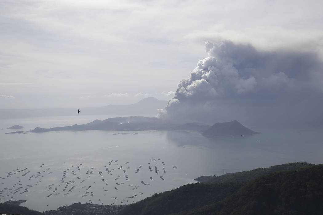Taal Volcano continues to spew ash on Monday Jan. 13, 2020, in Tagaytay, Cavite province, south ...