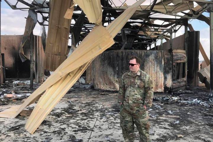A U.S. soldier stands at a site of Iranian bombing, in Ain al-Asad air base, Anbar, Iraq, Monda ...
