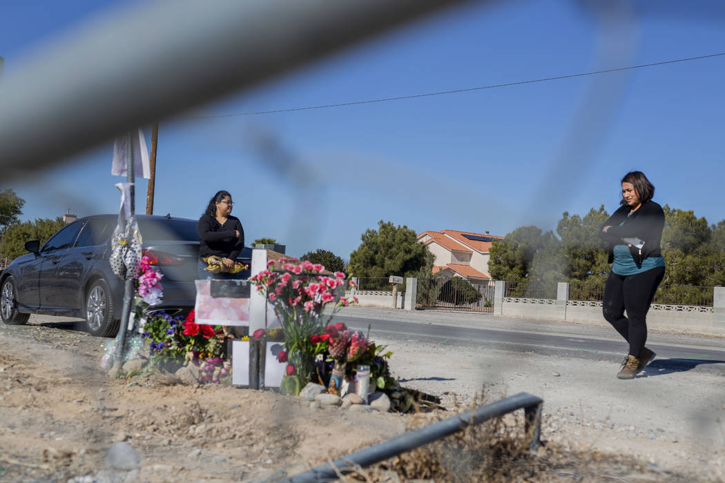 Sisters Andrea Lopez, left, and Ruth Neall look at the memorial on Monday, Jan. 13, 2020, at th ...