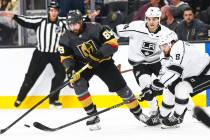 Golden Knights' Alex Tuch (89) battles for the puck against Los Angeles Kings' Nikolai Prokhork ...