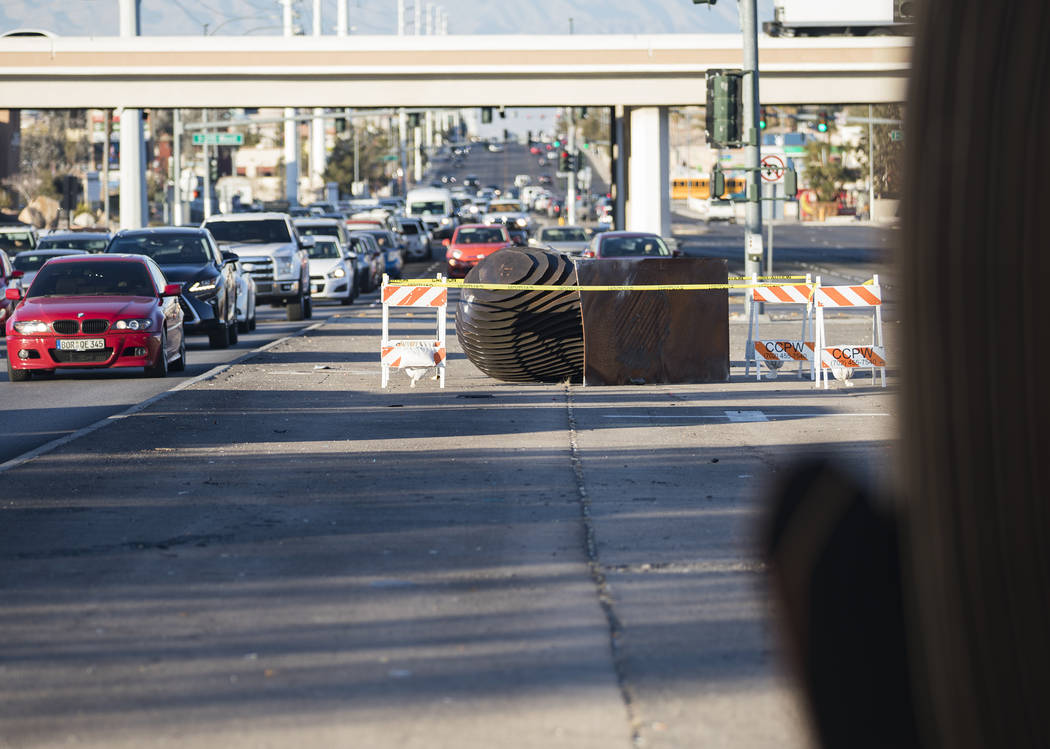 An SUV crashed into and knocked over one of two "Norte Y Sur" steel head sculptures in the medi ...