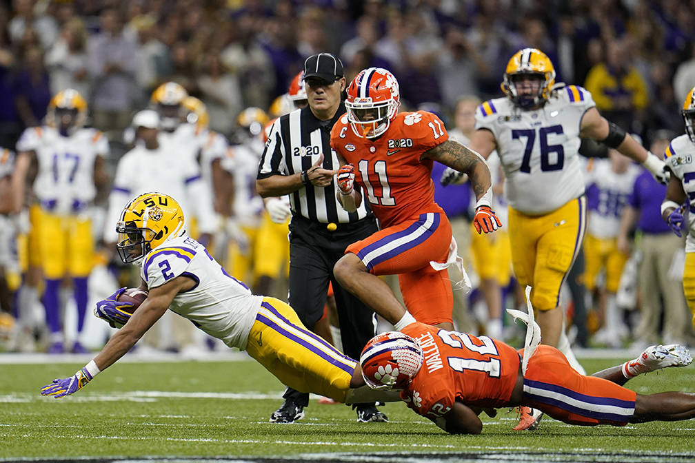 LSU wide receiver Justin Jefferson is tackled by Clemson safety K'Von Wallace during the second ...