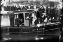 In this 1922 file photo, spectators gather by the side of captured rum runner, Silver Spray, as ...
