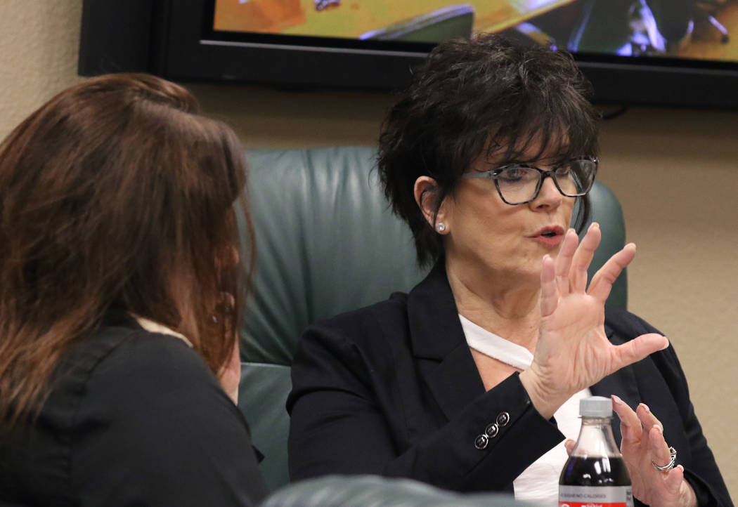 Nevada State Board of Dental Examiners executive director, Debra Shaffer-Kugel, right, speaks a ...