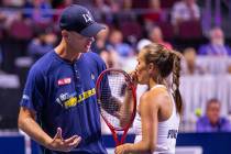 Vegas Rollers head coach Tim Blenkiron confers with Monica Puig in a timeout during her women's ...