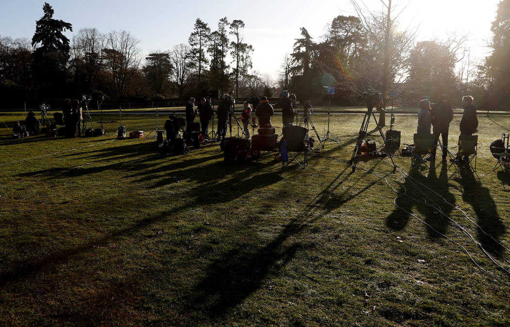 The media prepare at the entrance of Sandringham estate, Sandringham, England, early morning Mo ...