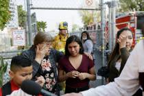 Student Marianna Torres, 11, center, cries as she recounts her exposure to fuel fumes as childr ...